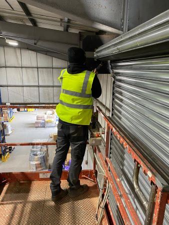 Roller-door being repaired